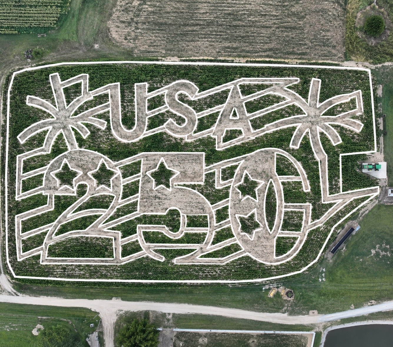 Aerial view of the 2026 Mayse Farm Market corn maze, cut to read USA 250 with stars, stripes and fireworks